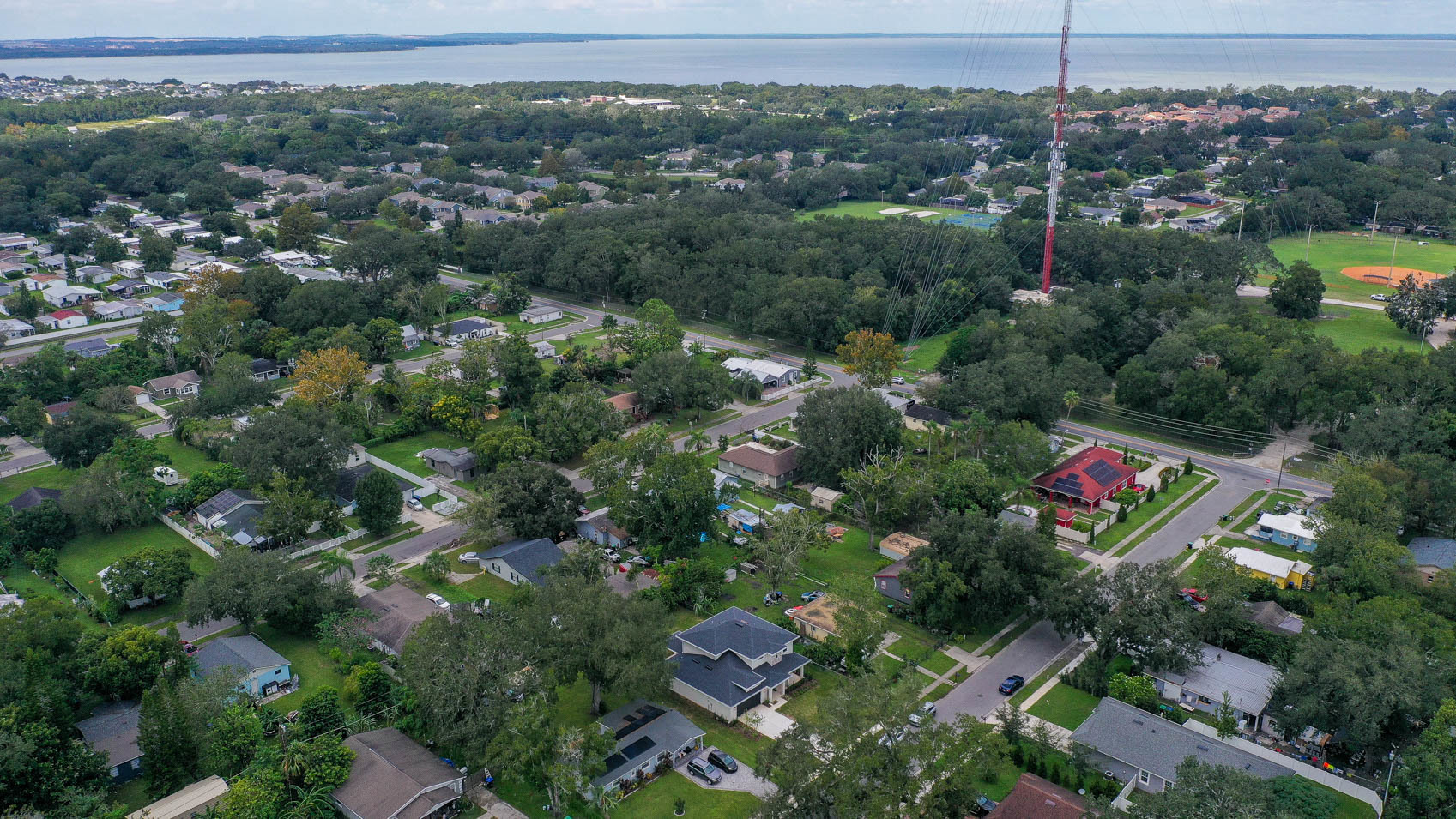 drone shot of winter garden with homes and lots of trees