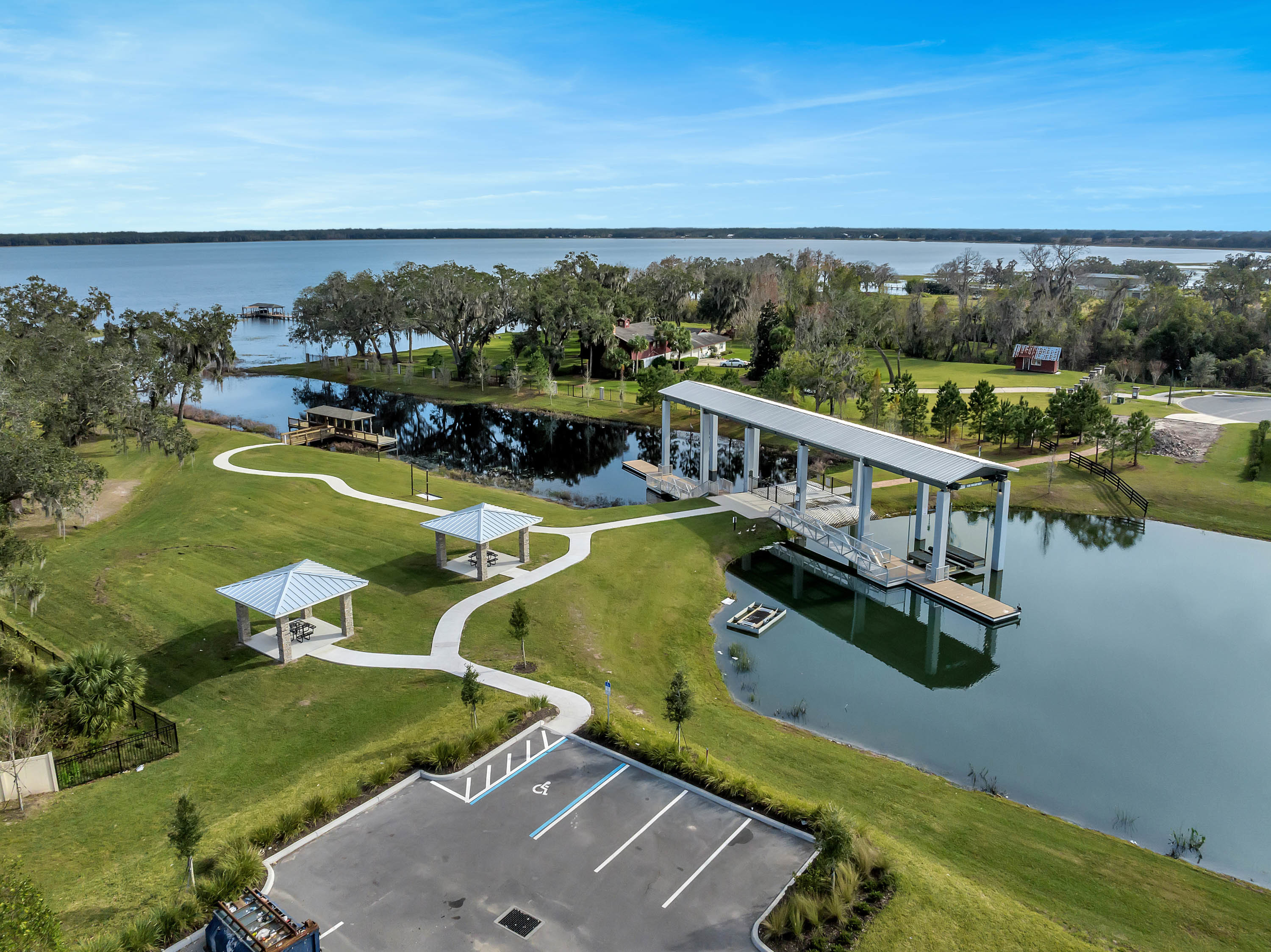 lake with bridge and greenery