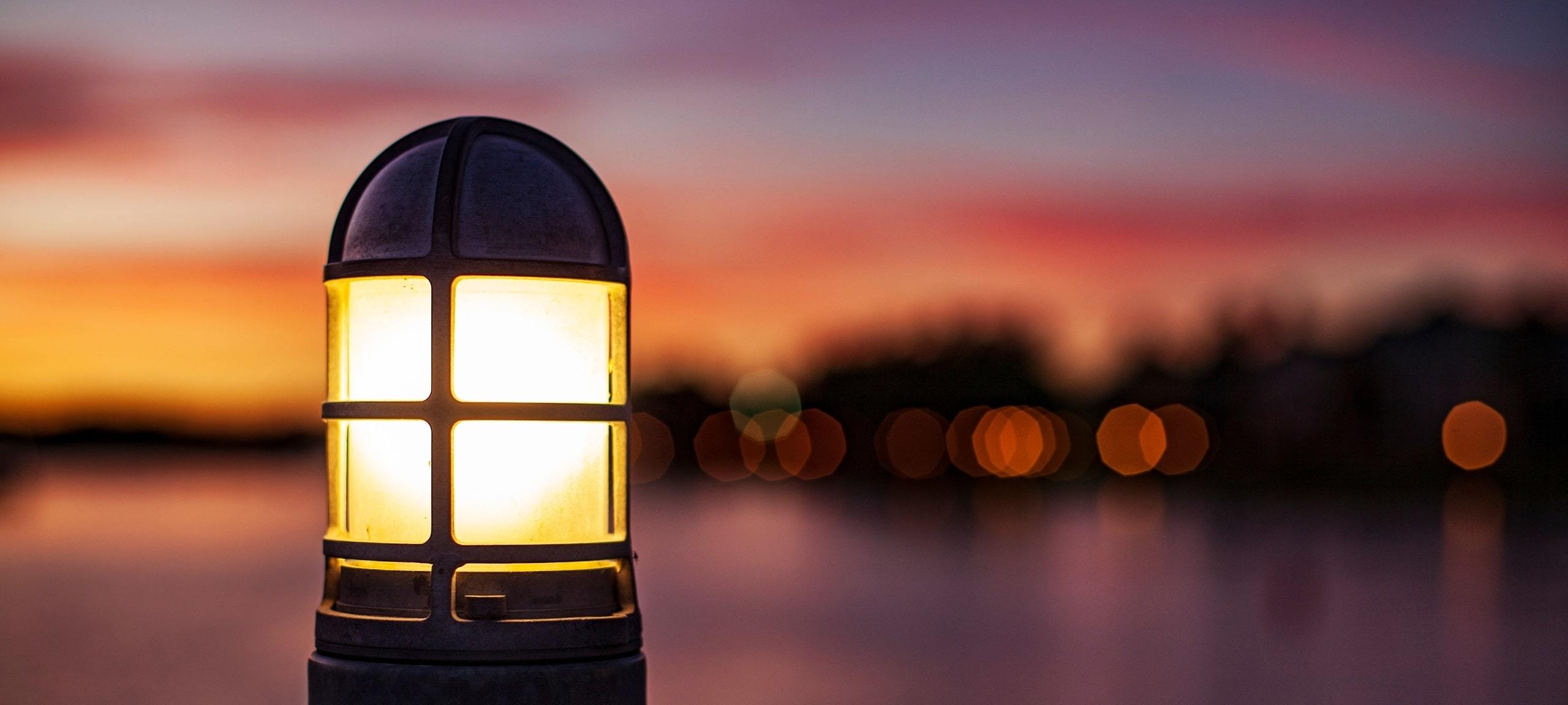 Pier light during sunset with defocused waterfront in background, near Horizon West, FL