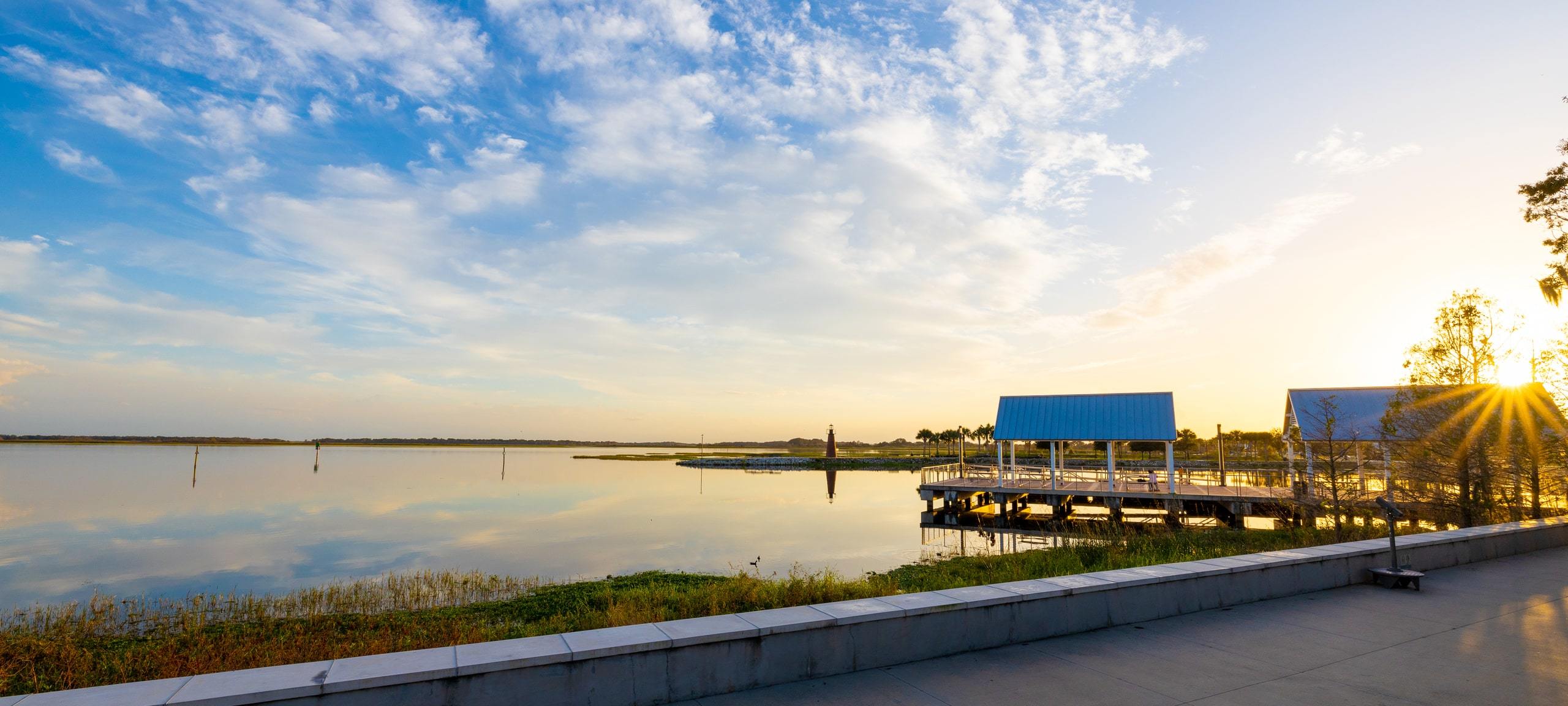 Sunset bursting through steamboat docks at Kissimmee Lakefront Park, Kissimmee