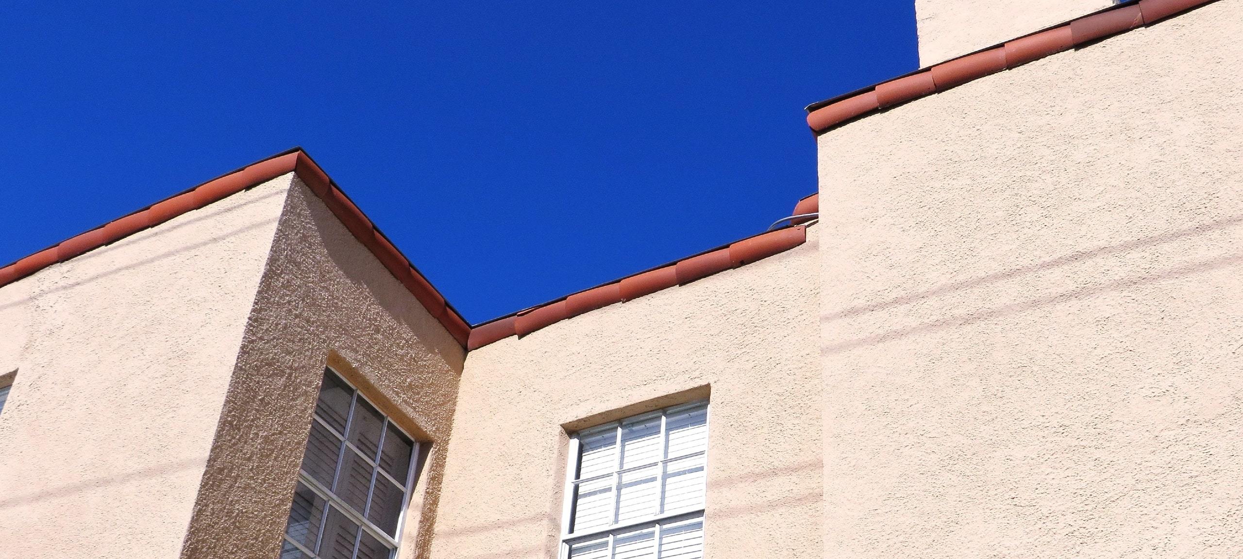Upwards view of Mediterranean style condo building, typical of Lake Mary