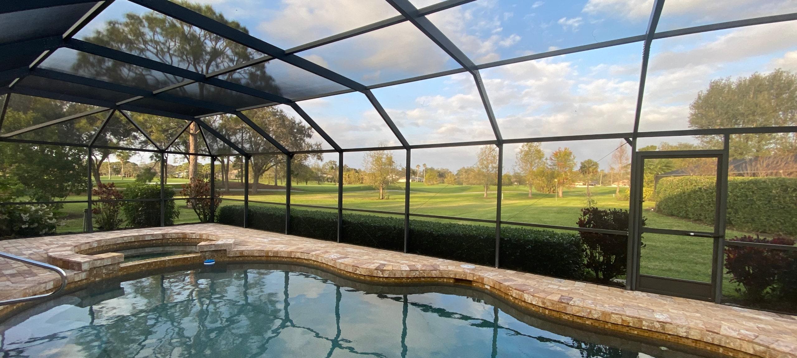 In-ground backyard pool with views of golf course, typical of Lake Mary, FL