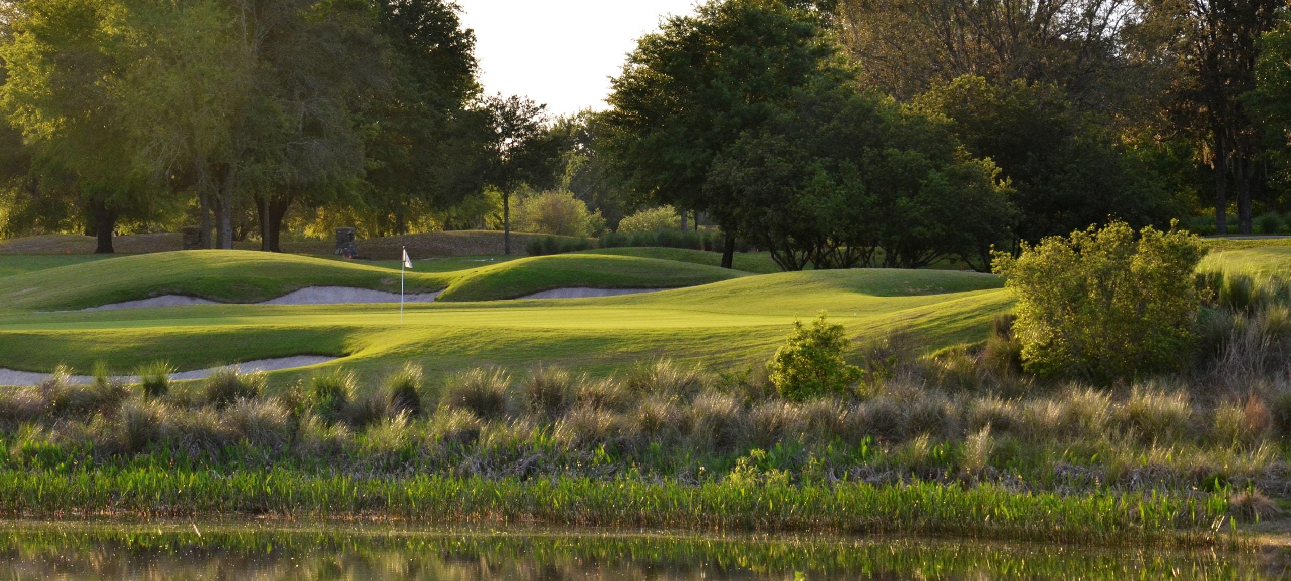 Sunrise on golf course with rolling hills and lake near Mount Dora, FL