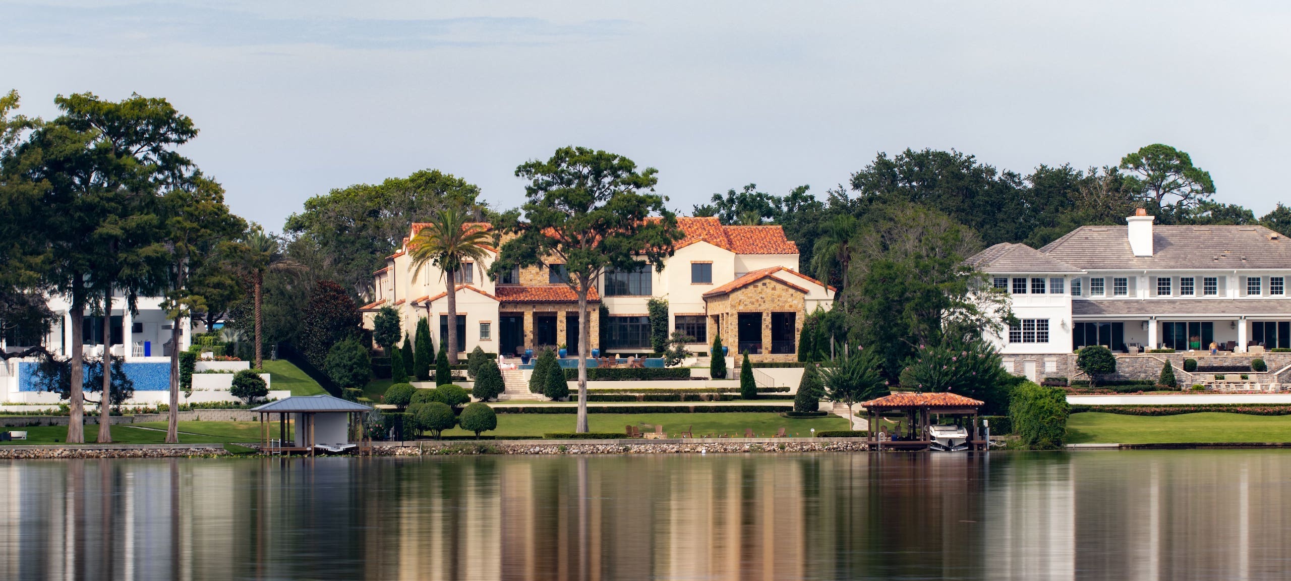 Luxury waterfront homes along nestled among trees in Orlando, FL.